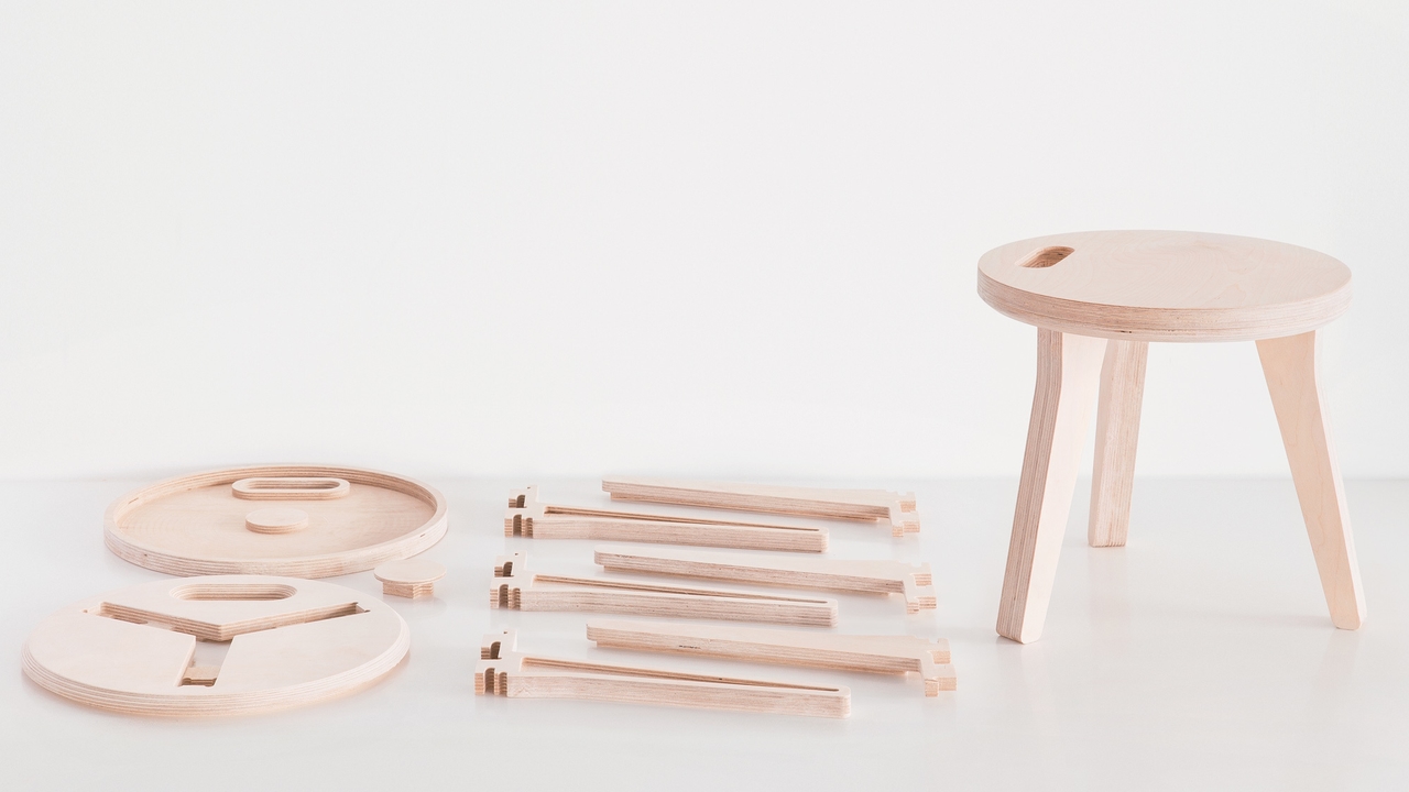 A Opendesk Edie Stoll designed by Joni Steiner in plywood and being disassembled